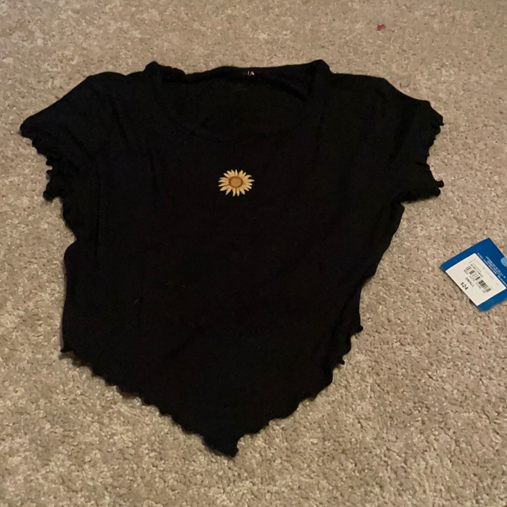 Black sunflower shirt.